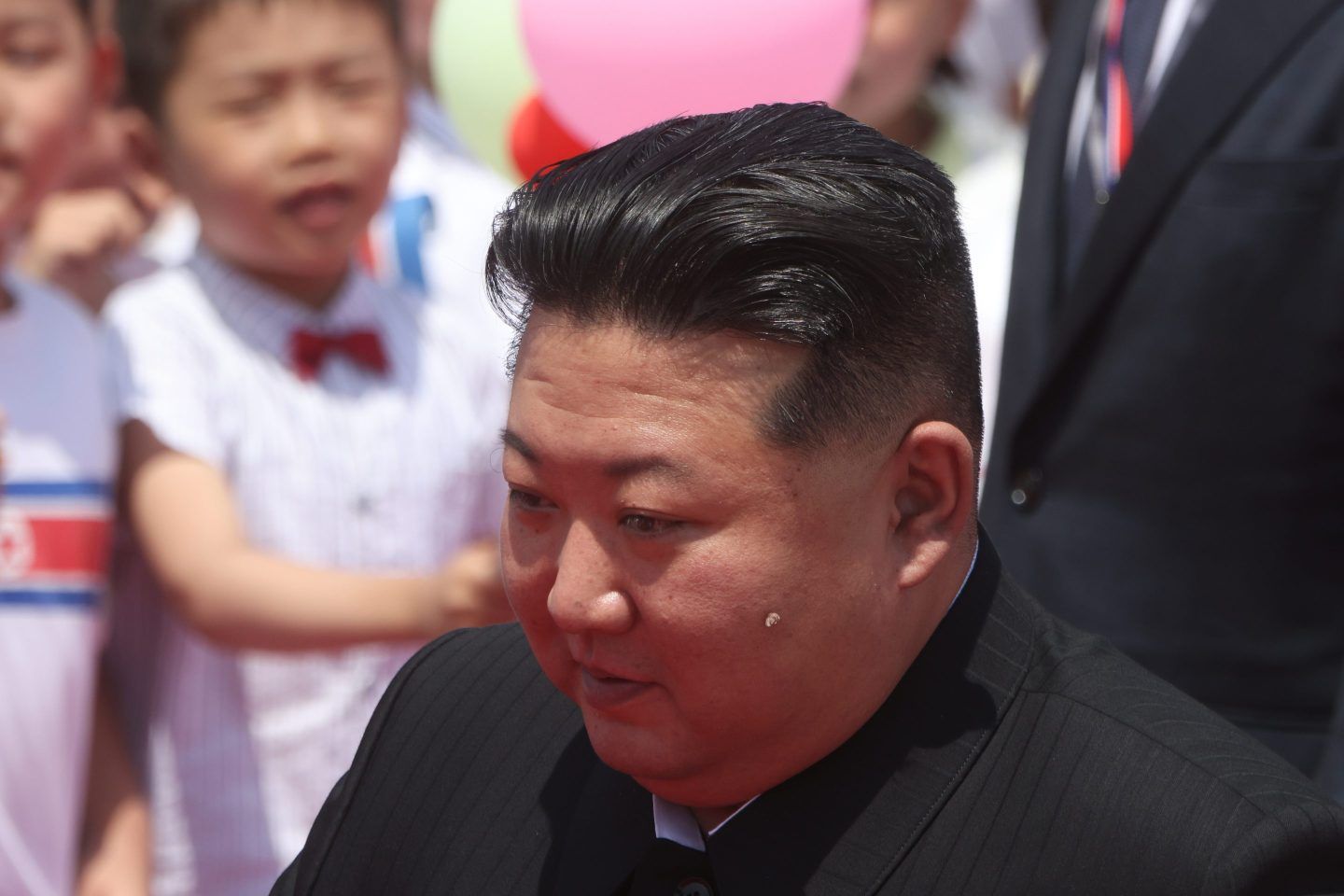 North Korean Supreme Leader Kim Jong Un greeting children in 2024.