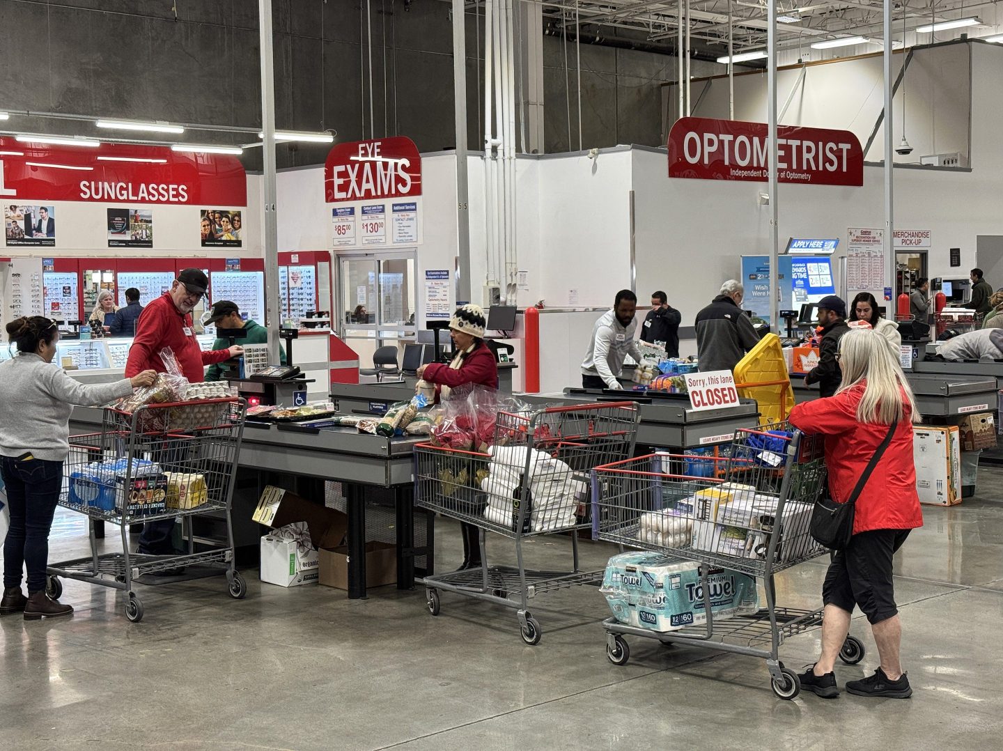 Costco customers wait on a checkout line in California