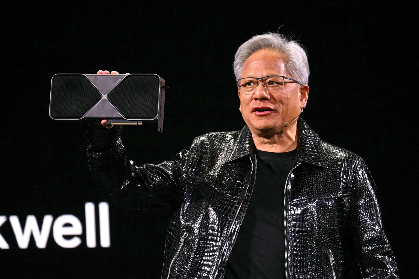 Nvidia CEO Jensen Huang holding a GPU earlier this year at the Consumer Electronics Show (CES) in Las Vegas.