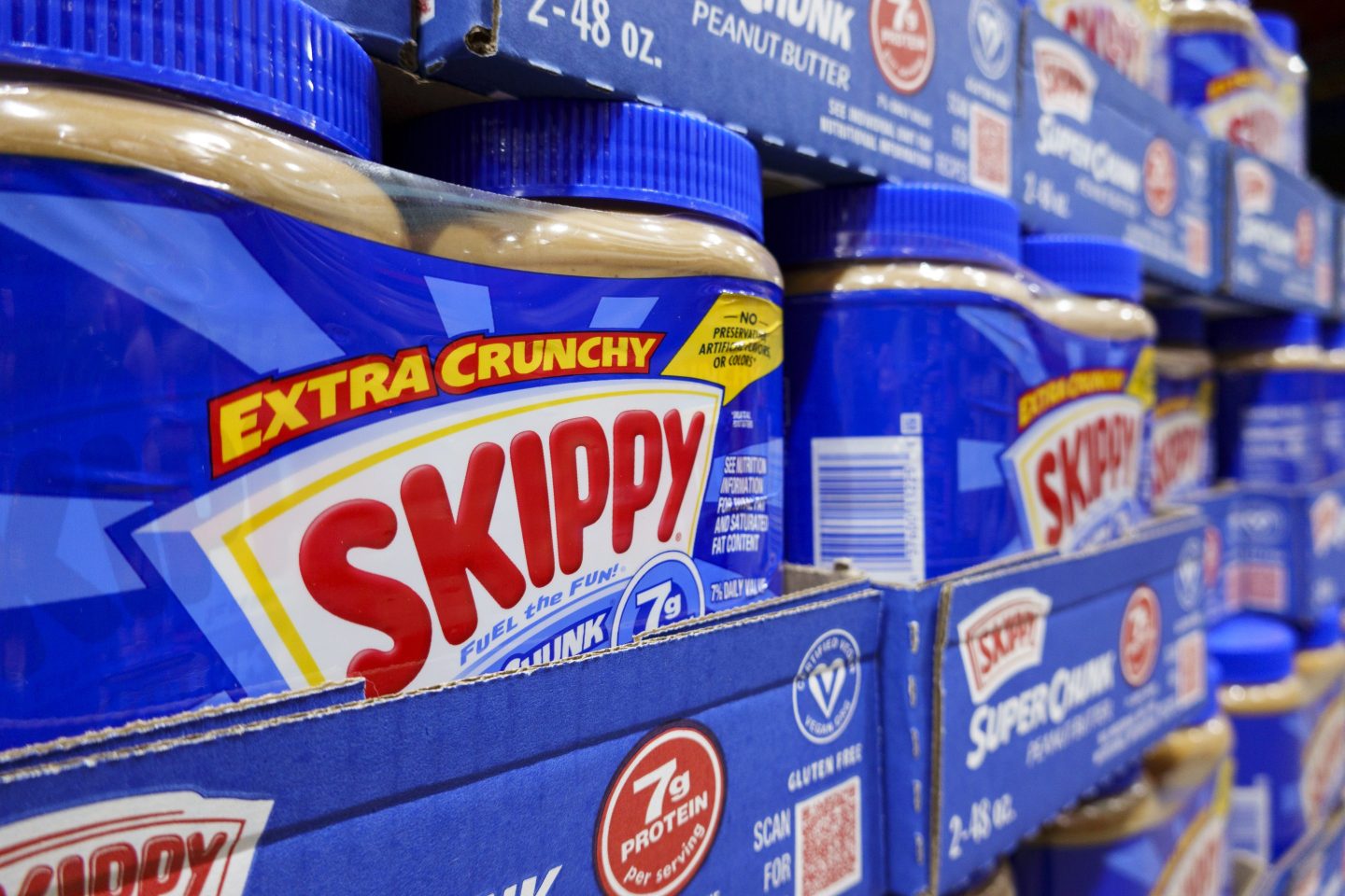 Packages of Skippy peanut butter are stacked at a Costco Wholesale store on April 4, 2025 in San Diego, California.