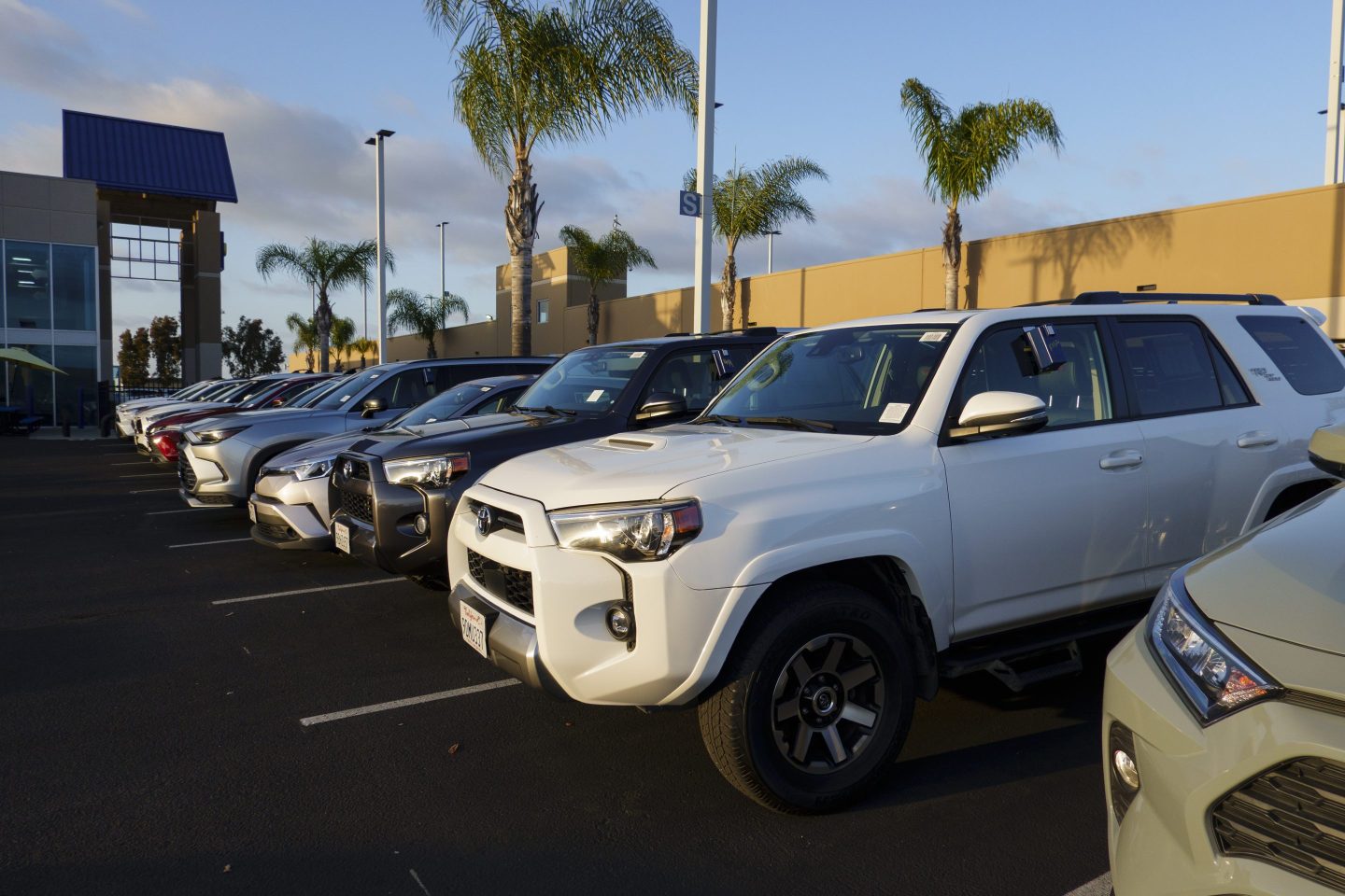 Vehicles for sale are parked in a lot at a CarMax dealership