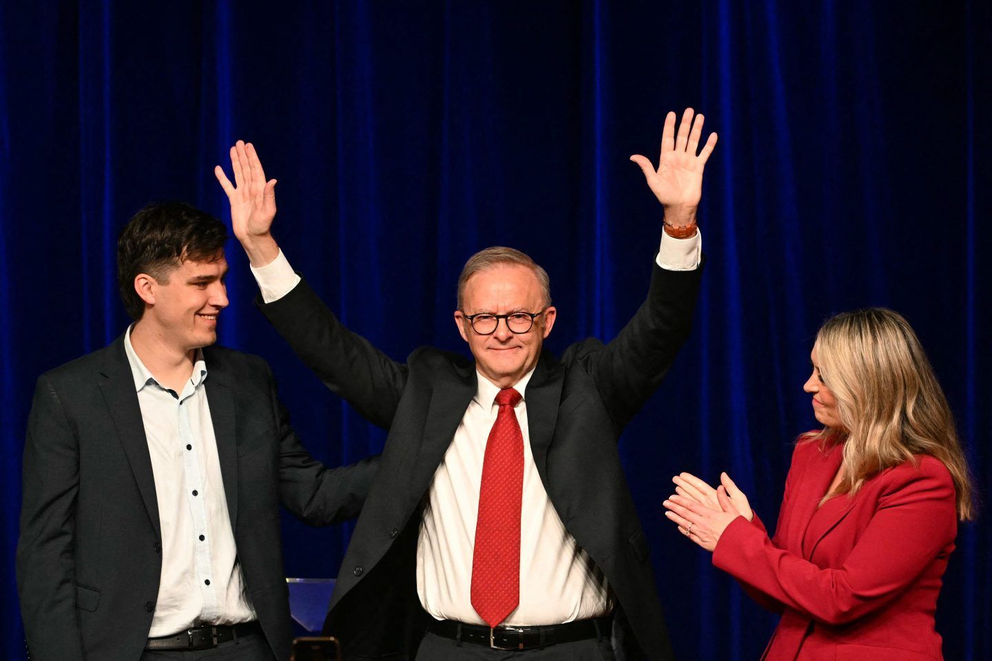 Australia's Prime Minister Anthony Albanese celebrates with his partner Jodie Haydon and son Nathan after winning the general election at the Labor Party election night event in Sydney on May 3, 2025.