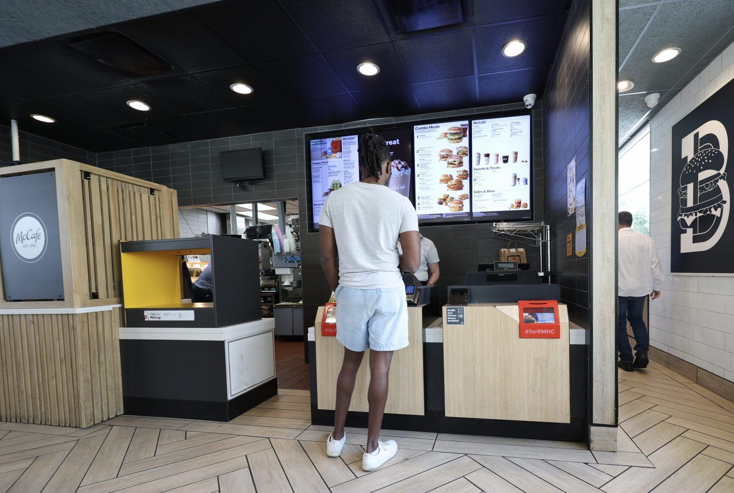 A customer waits on an order in a McDonald's restaurant on May 1, 2025 in Miami.