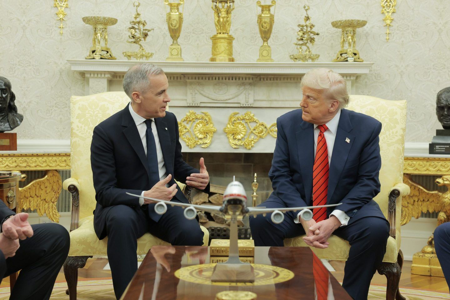U.S. President Donald Trump speaks to Canadian Prime Minister Mark Carney in the Oval Office at the White House on May 6, 2025.