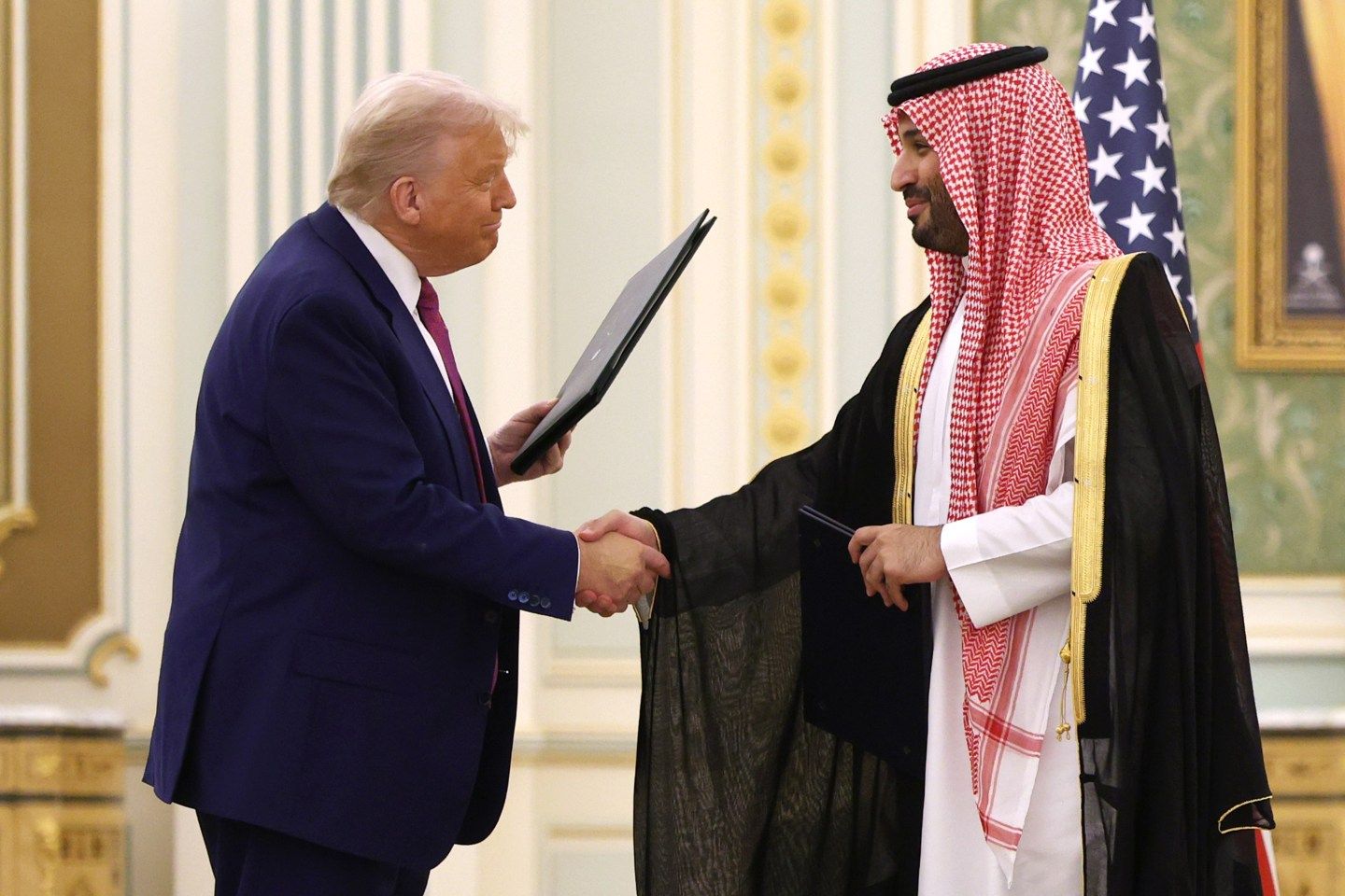 U.S. President Donald Trump shakes hands with Saudi Crown Prince Mohammed Bin Salman during Trump's visit to the Middle East.