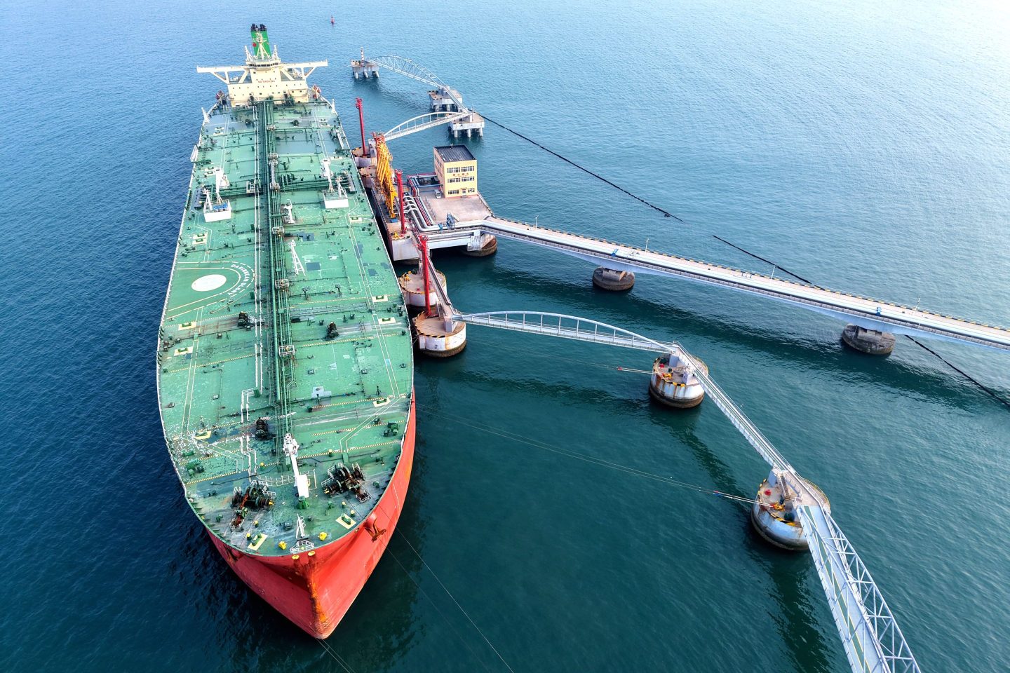 An oil tanker unloads imported crude oil at the crude oil terminal of Qingdao Port in Qingdao City, Shandong Province, China, on May 21.
