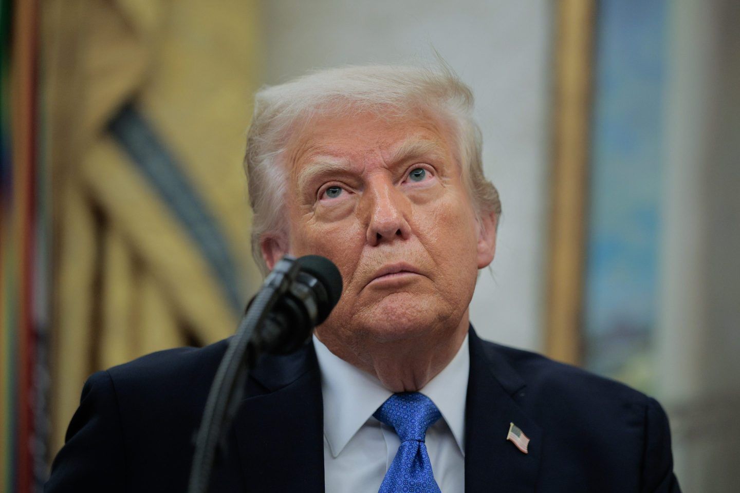 President Donald Trump answers reporters' questions after he posthumously awarded the new Medals of Sacrifice to fallen officers during a ceremony in the Oval Office of the White House on May 19, 2025 in Washington, DC.