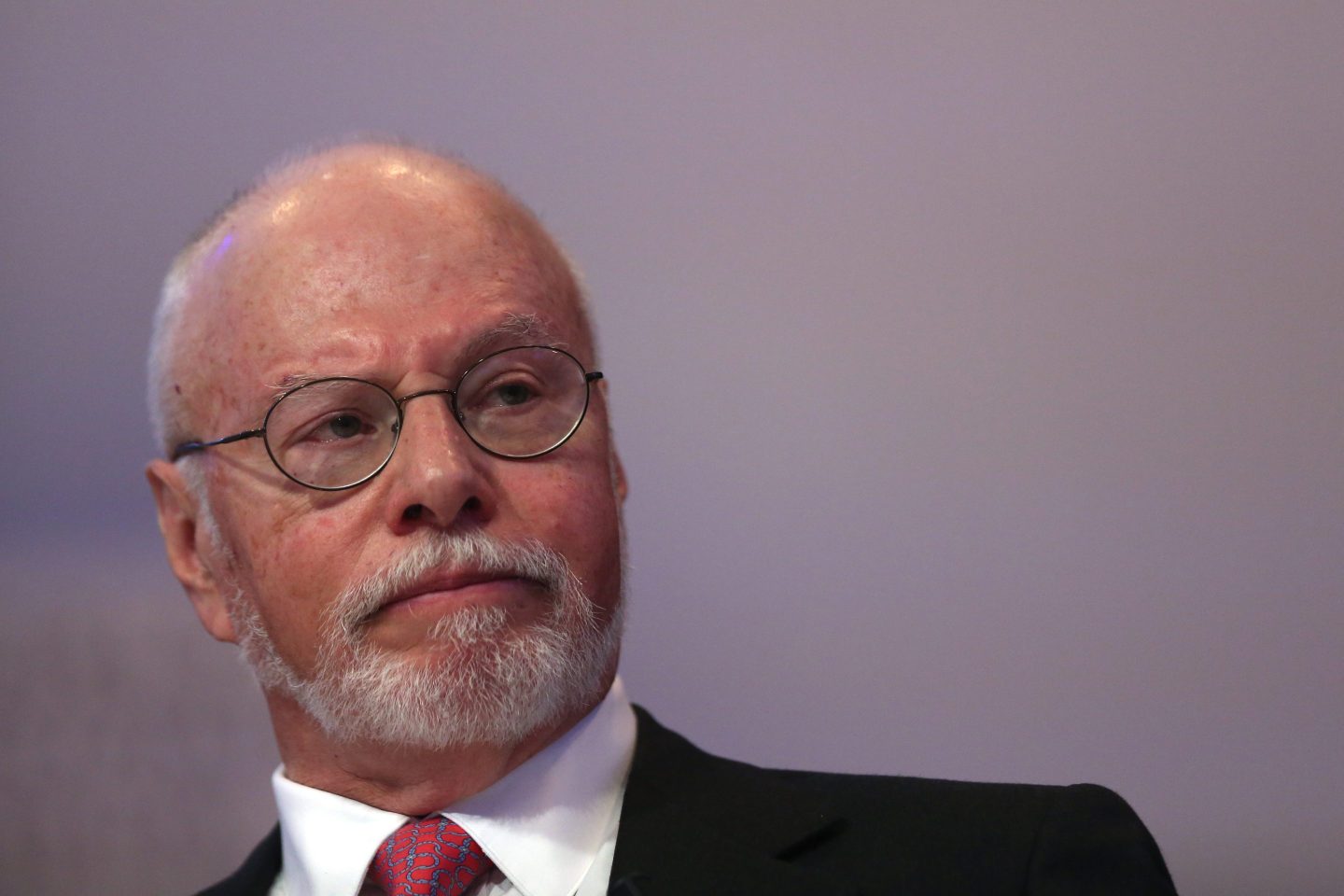 Paul Singer sits during a conference panel.