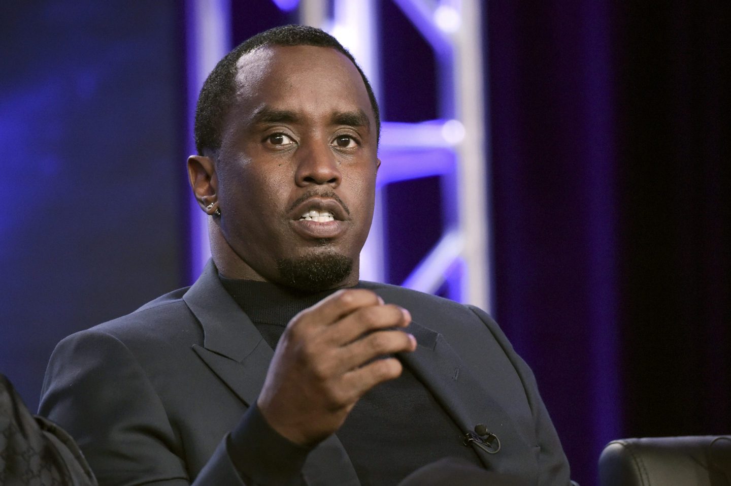 Sean "Diddy" Combs sits in a chair