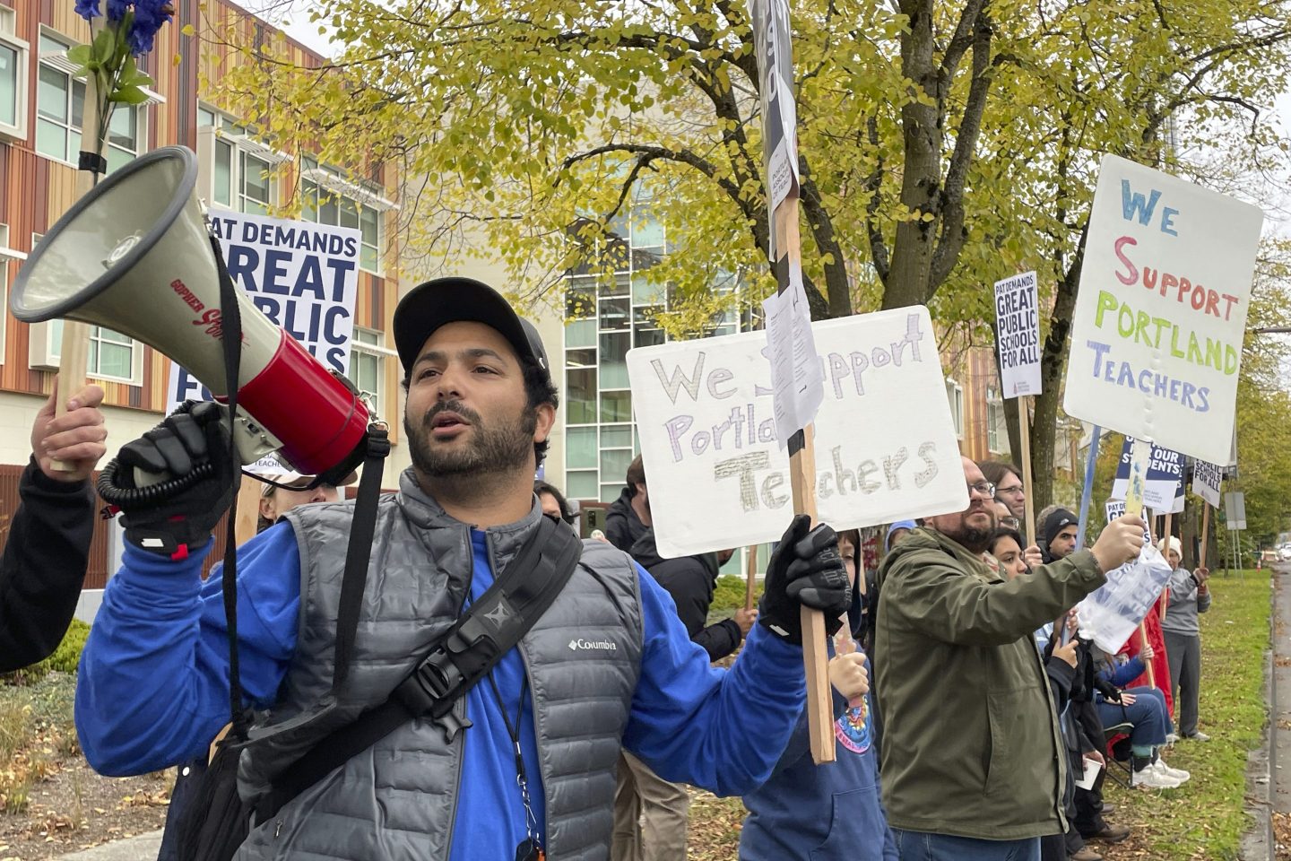 Teachers and their supporters hold signs, chant and rally the crowd with bullhorns on the first day of a teacher's strike in Portland, Ore., on Nov. 1, 2023.