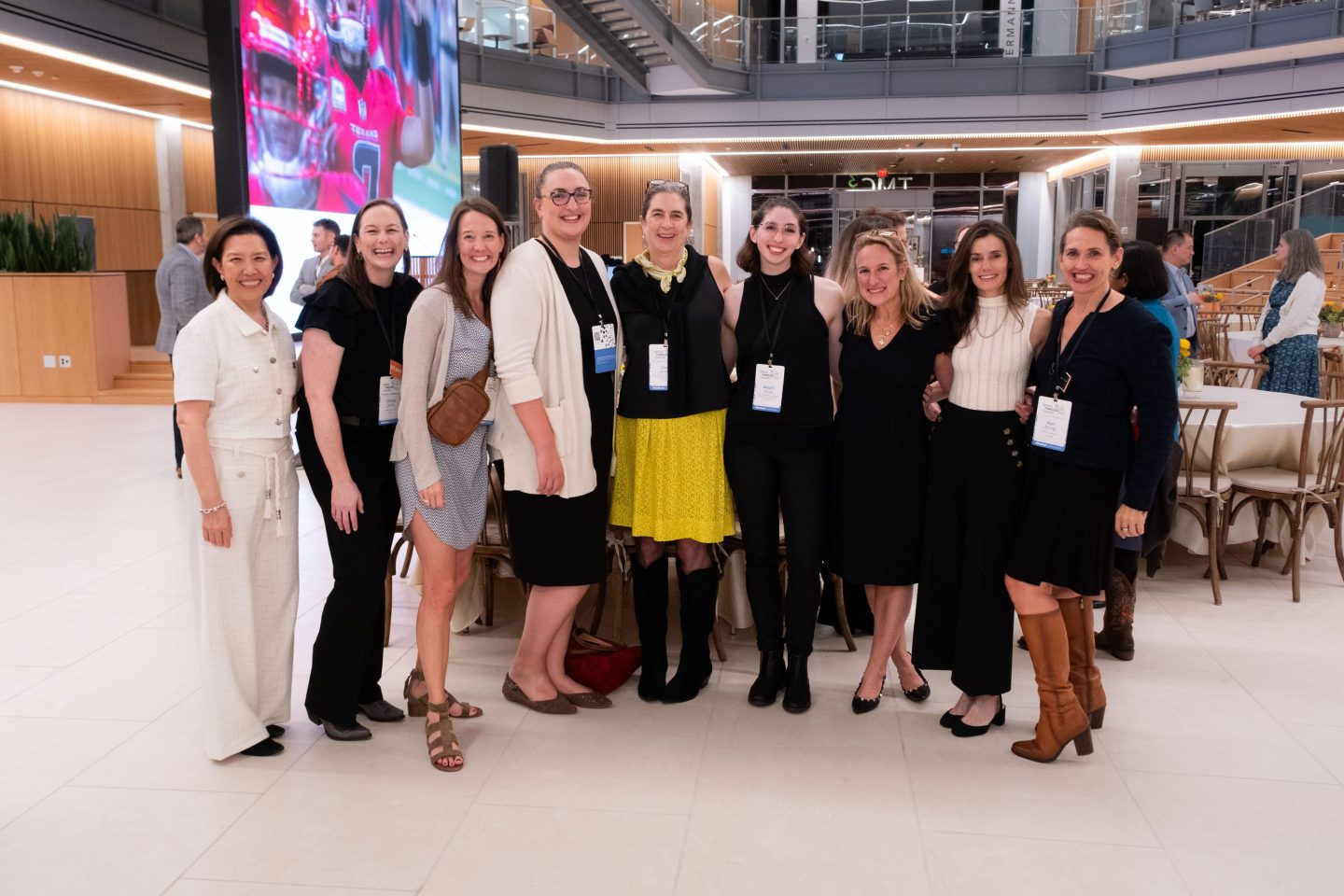 Group of women standing together at a medical conference.