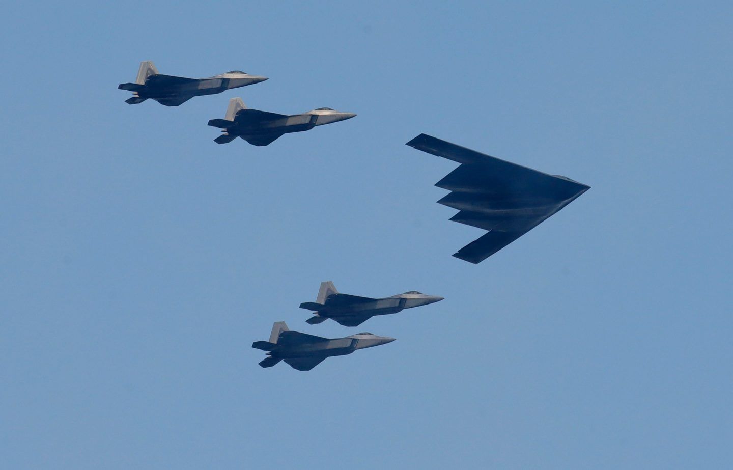 A B-2 bomber leads a group of fighter jets during a military flyover above Bayonne, N.J., on July 4, 2020.
