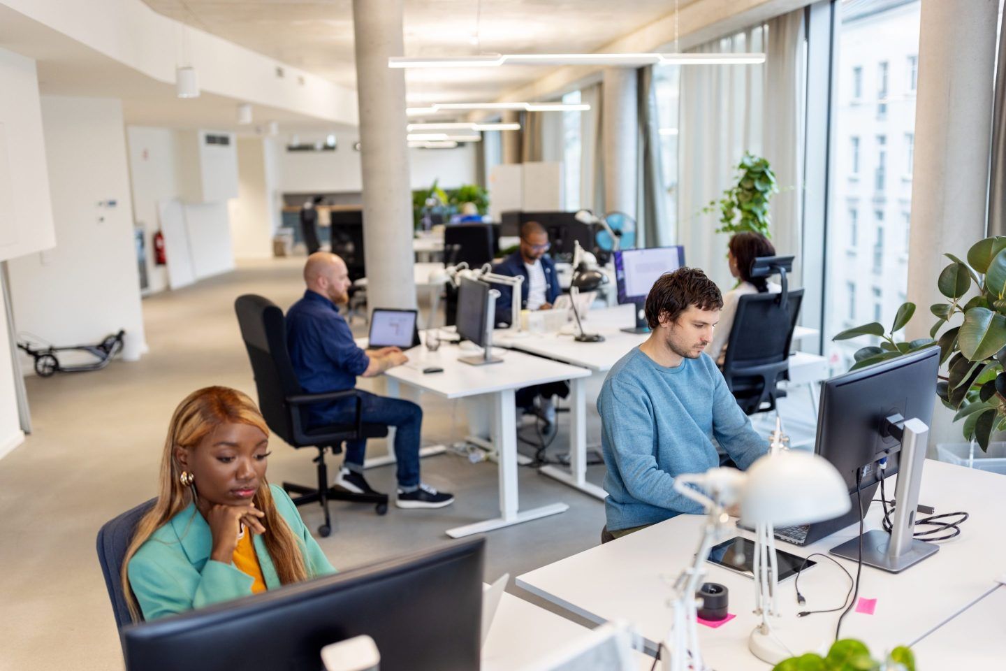 Multiracial business people working at their desks in office