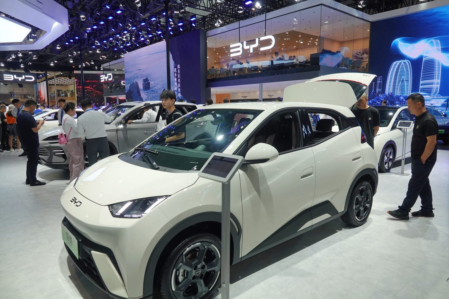 Spectators look at BYD Seagull electric cars at the 21st Changchun International Automobile Expo in Changchun last July.