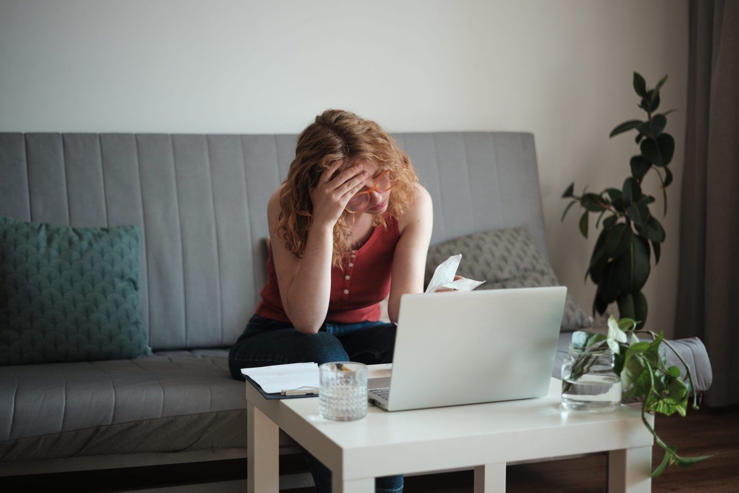 woman looking stressed paying bills