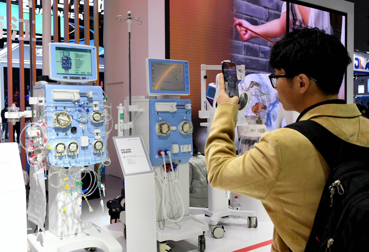 A visitor takes a photo at the 2025 China Medical Equipment Conference & Medical Equipment Exhibition at the Chongqing International Expo Center on March 14, 2025 in Chongqing, China.
