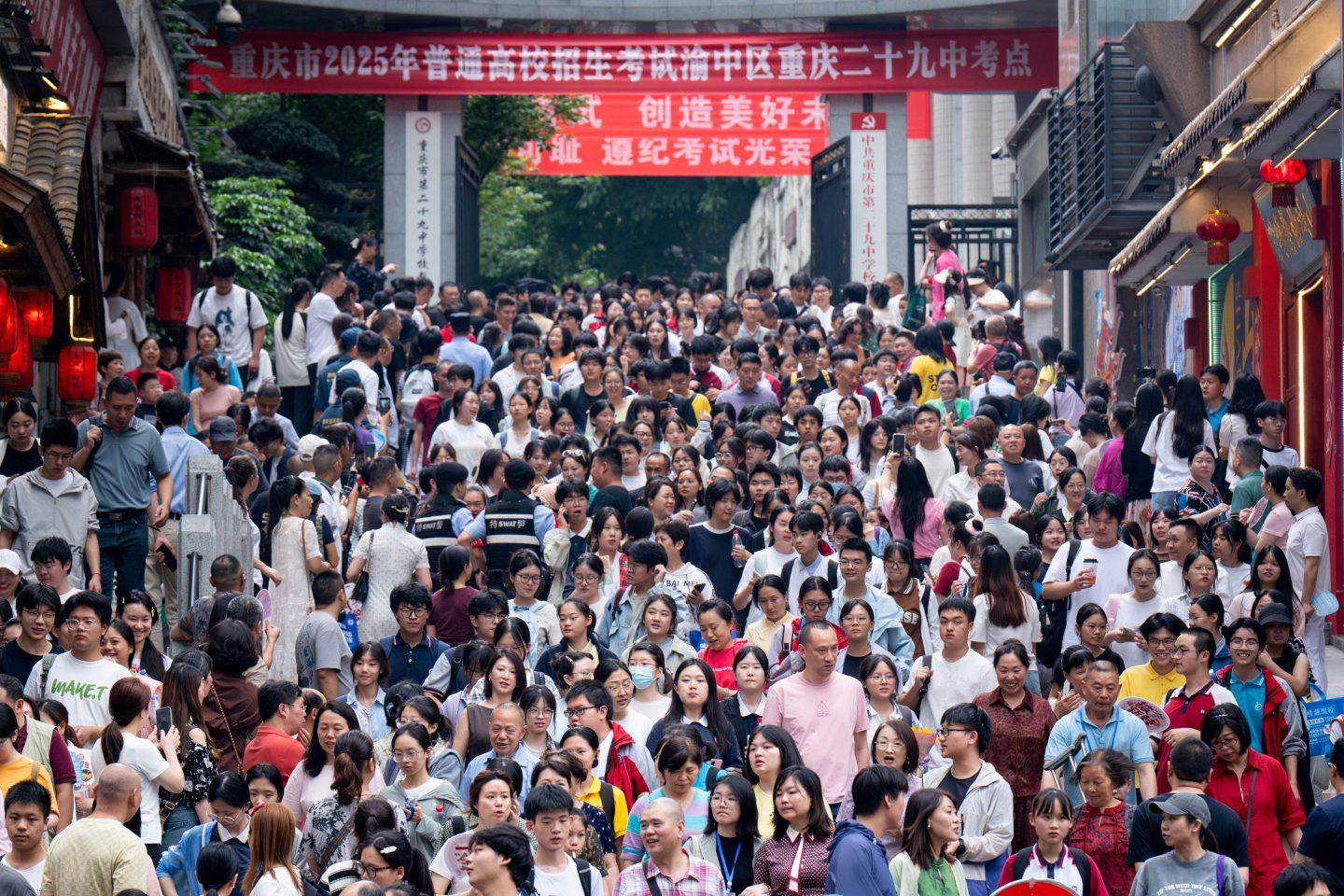 Students walk out to meet their parents after sitting China's National College Entrance Examination (NCEE), known as "gaokao", on June 7, 2025.