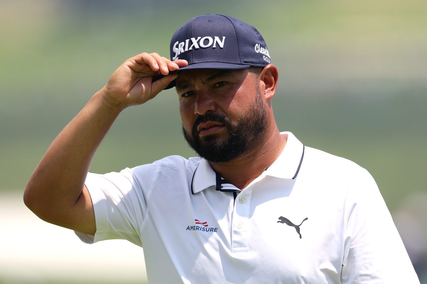 JJ Spaun tips his cap