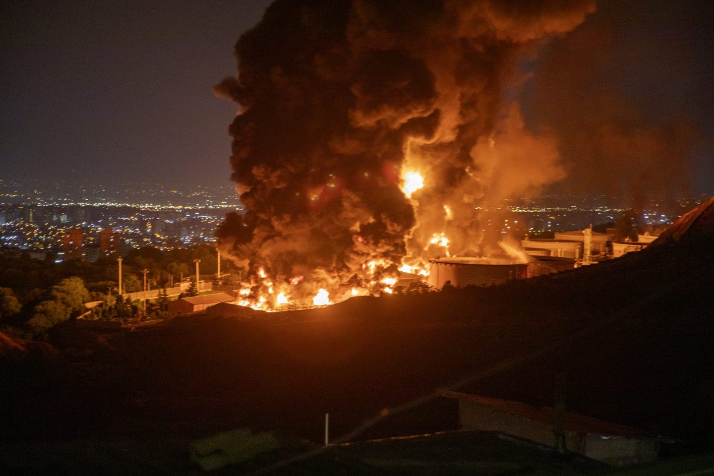 Fire and smoke rise into the sky after an Israeli attack on the Shahran oil depot on June 15, 2025 in Tehran.