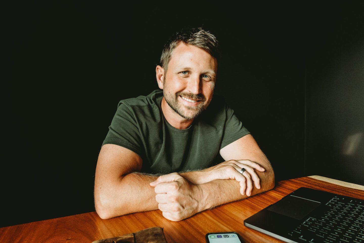 A headshot of Shane Mac smiling.