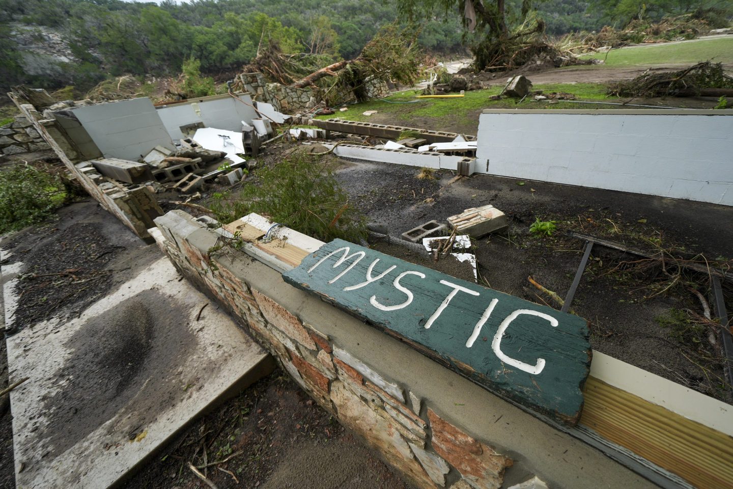 A Camp Mystic sign is seen near the entrance to the establishment along the banks of the Guadalupe River in Hunt, Texas, on July 5, 2025,.