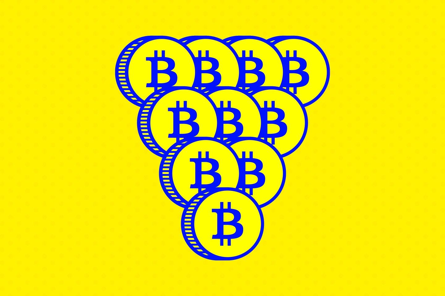 Coins with the Bitcoin logo imprinted on them stacked into a pyramid.