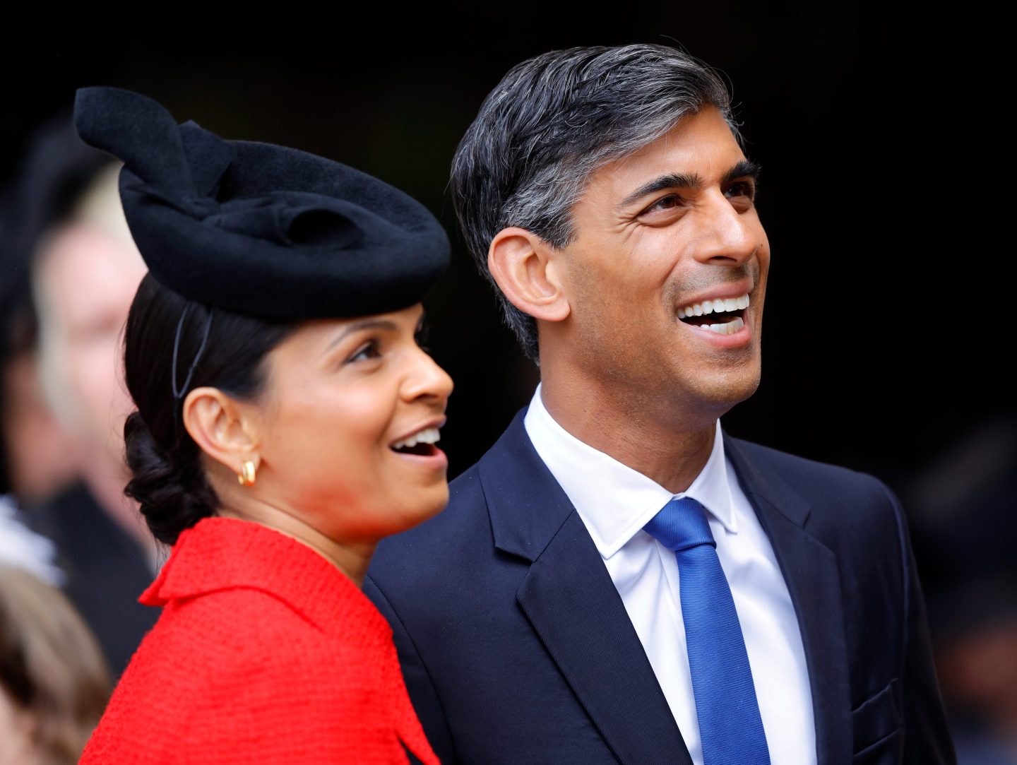 Rishi Sunak smiling with his wife, Akshata Murty