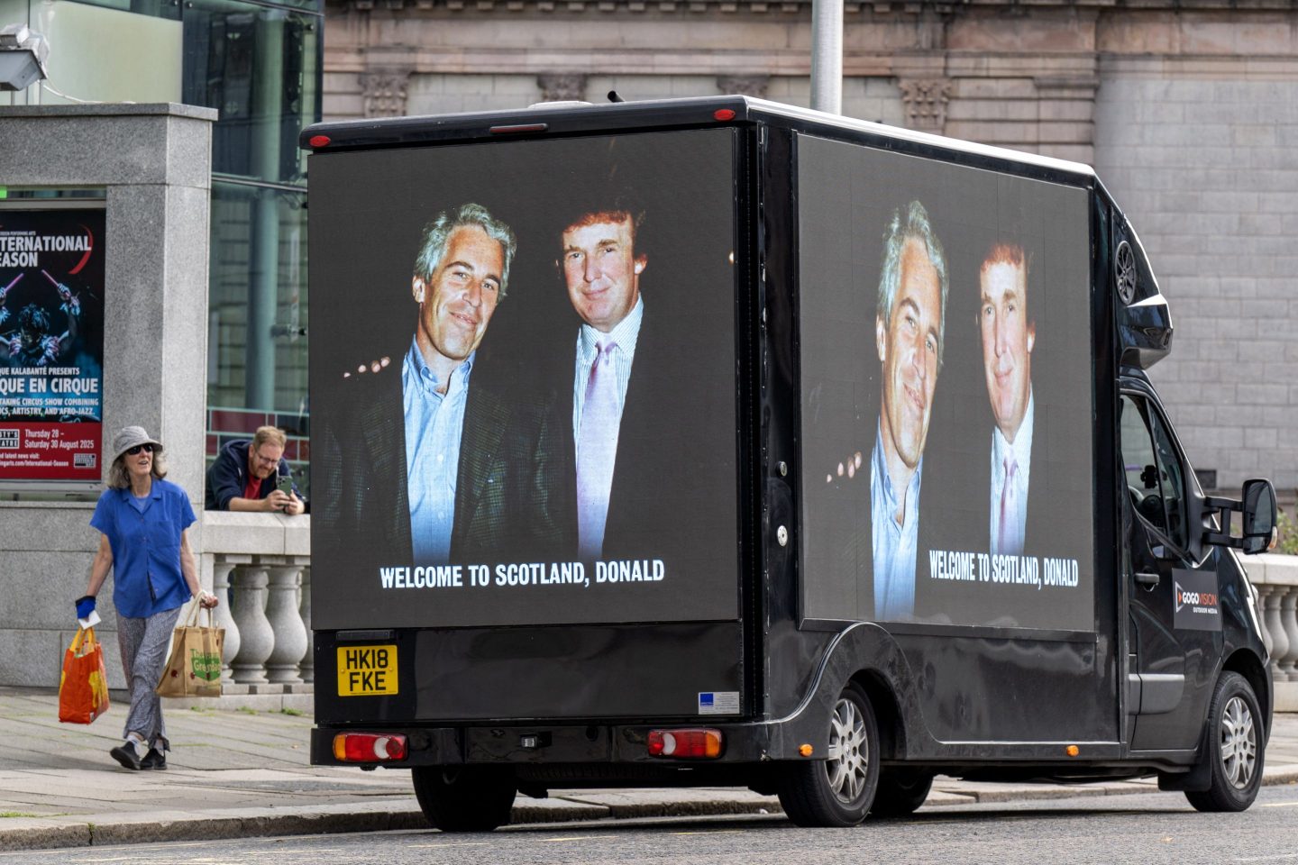 A truck with a picture of Trump with Jeffrey Epstein sits parked in Scotland