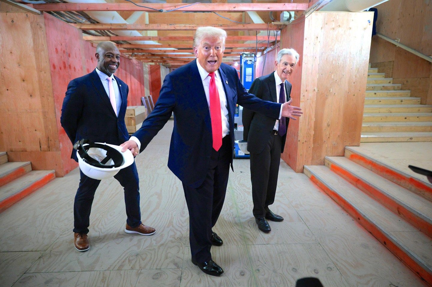 WASHINGTON, DC - JULY 24: (L-R) U.S. Sen. Tim Scott (R-SC), President Donald Trump and Federal Reserve Chair Jerome Powell tour the Federal Reserve’s $2.5 billion headquarters renovation project on July 24, 2025 in Washington, DC. The Trump administration has been critical of the cost of the renovation and Federal Reserve Chairman Jerome Powell. (Photo by Chip Somodevilla/Getty Images)
