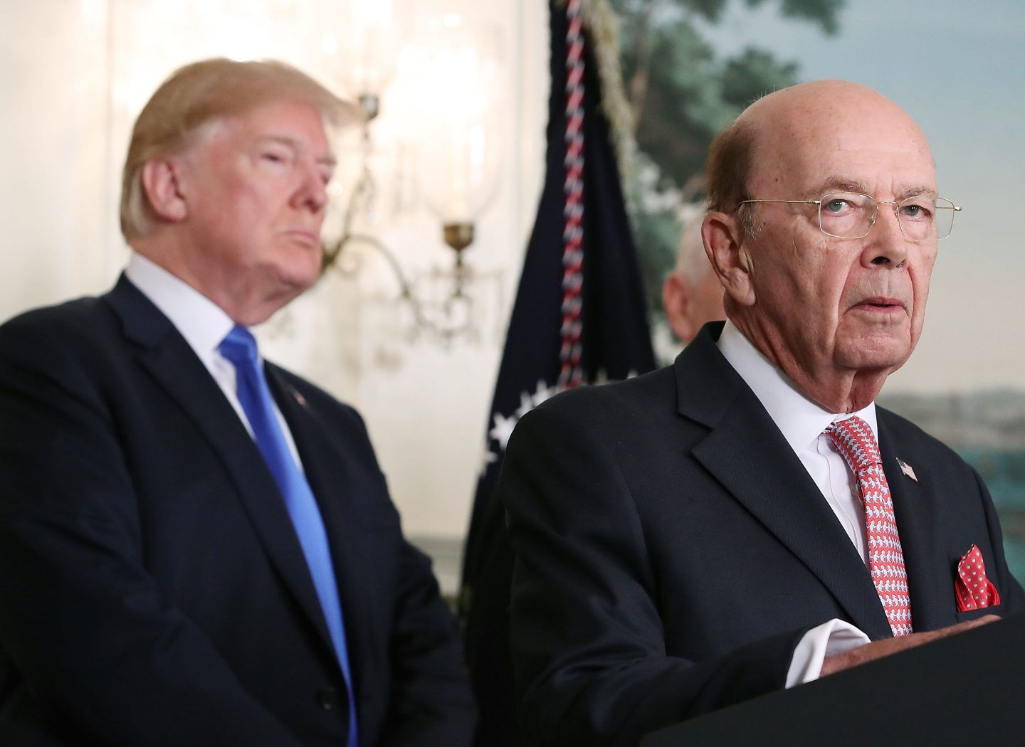 Former Commerce Secretary Wilbur Ross (R) speaks before U.S. President Donald Trump