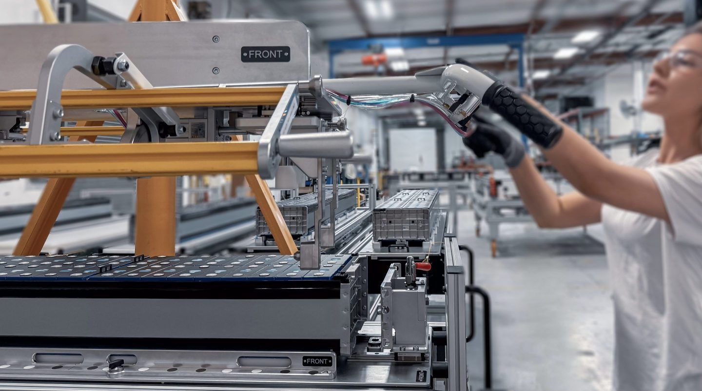 A manufacturing engineer prepares a battery storage submodule for lifting at Peak Energy's plant in California.