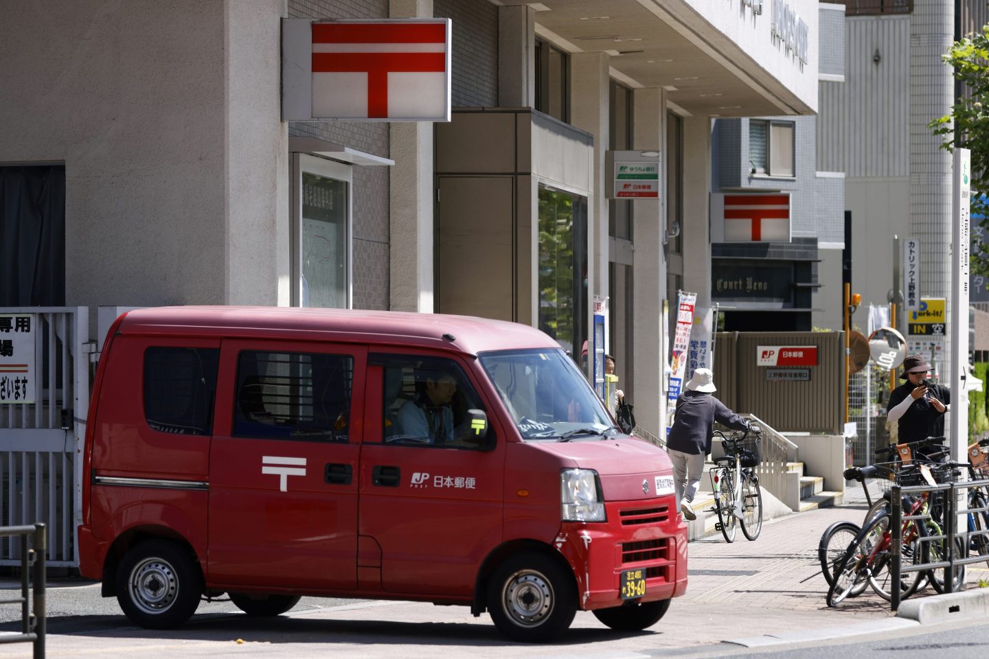 A Japan Post Co. postal van departs from one of the company's branches in Tokyo, Japan, on Monday, Aug. 7, 2023.