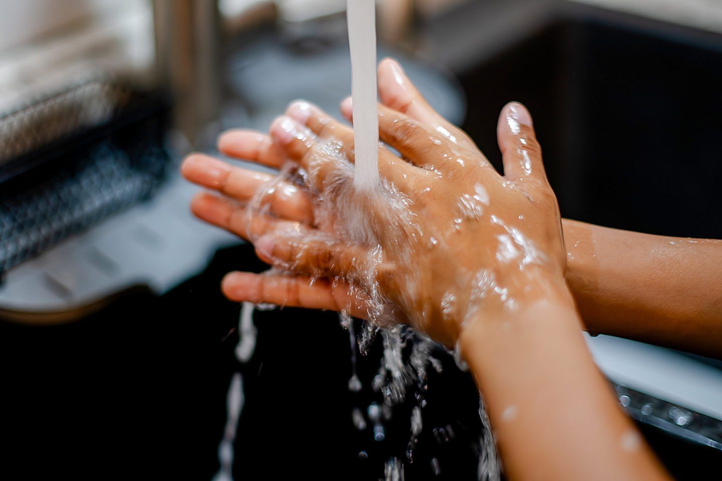 A person washing their hands