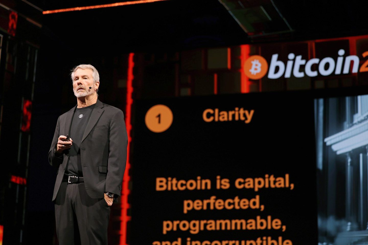 A photo of Michael Saylor on stage at a conference.