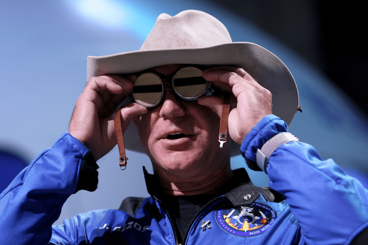 Jeff Bezos wearing a cowboy hat and goggles
