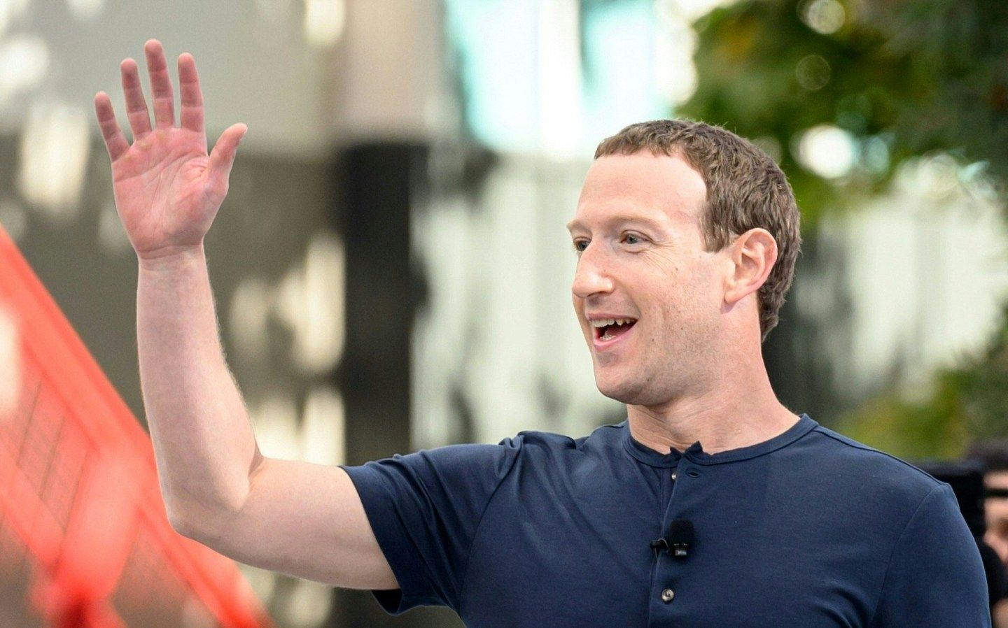 Mark Zuckerberg waves