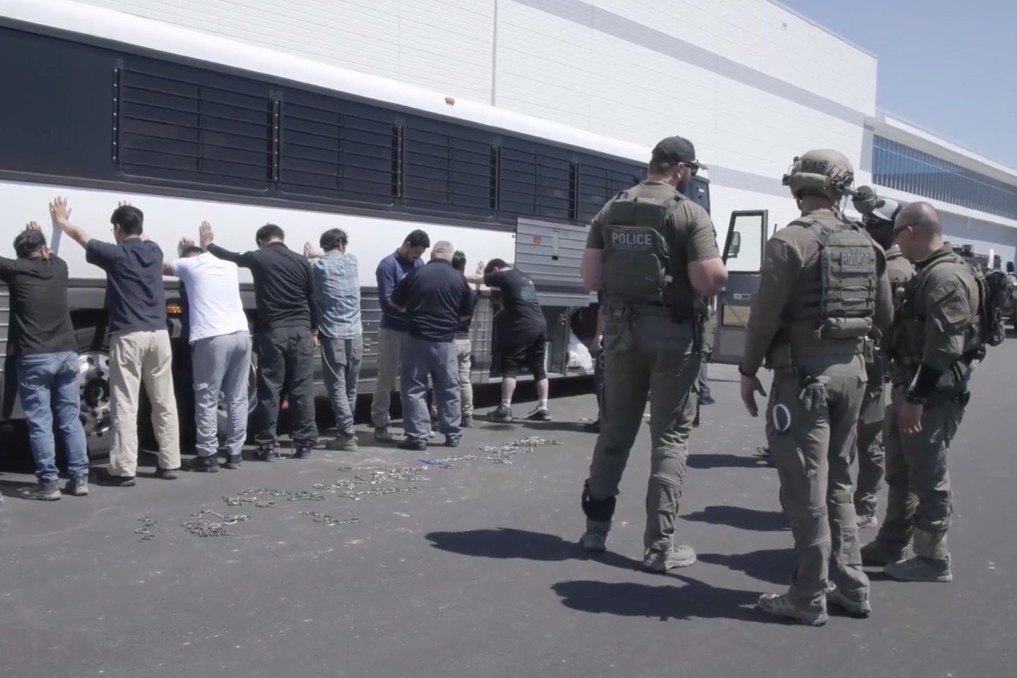 Employees waiting to have their legs shackled at the Hyundai Motor Group’s electric vehicle plant on Thursday.