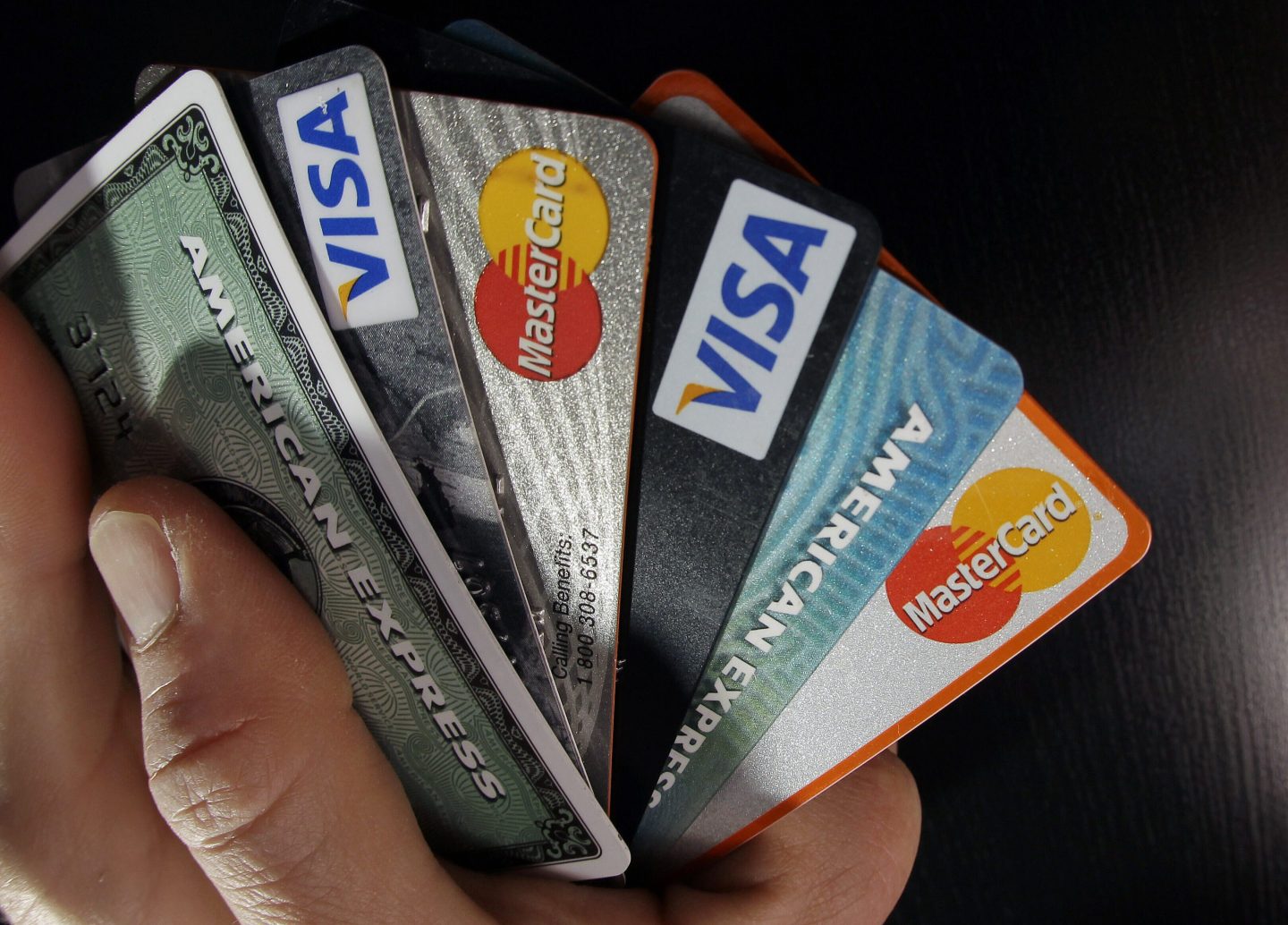 n this March 5, 2012, file photo, consumer credit cards are posed in North Andover, Mass.