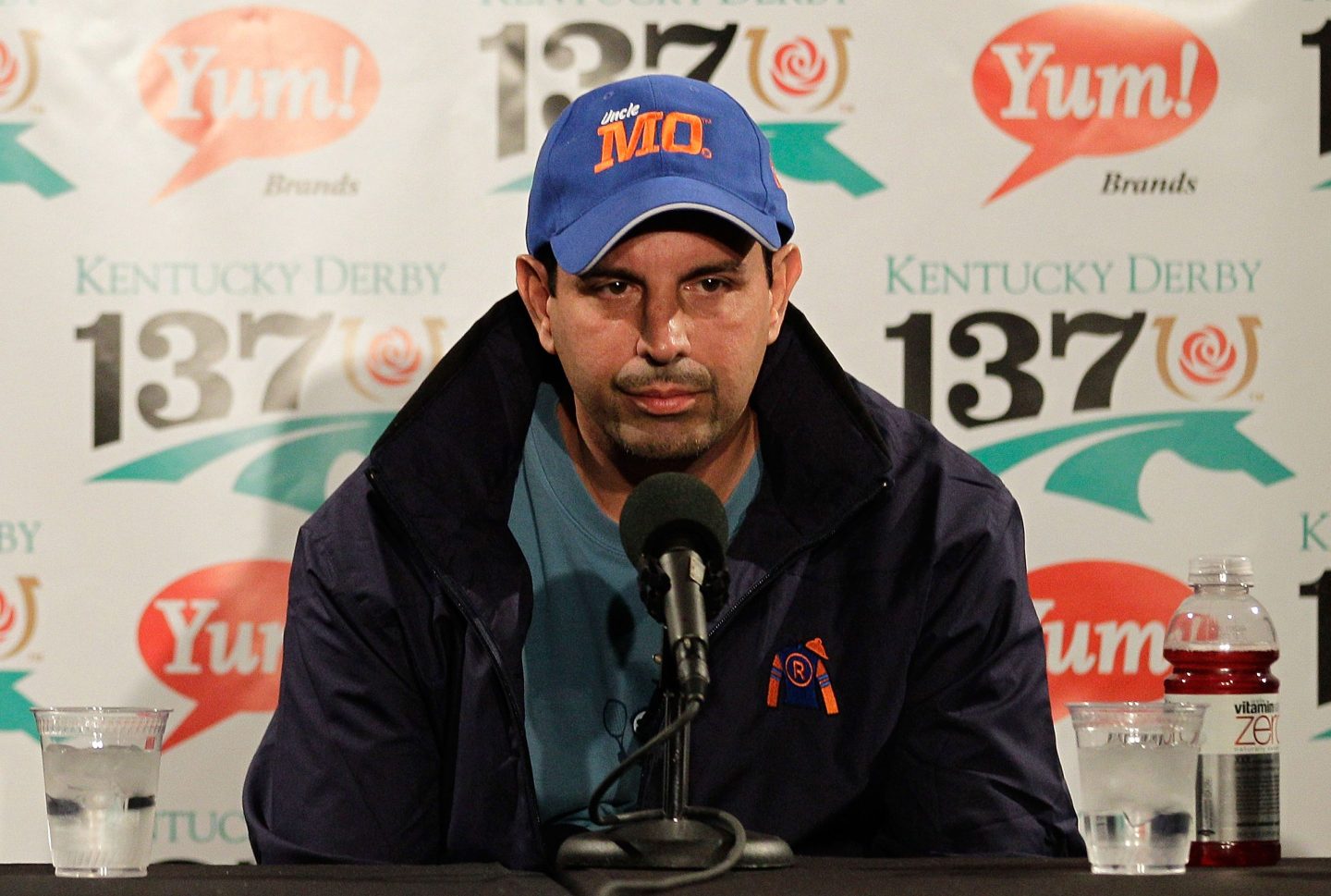 Mike Repole sits in front of a microphone