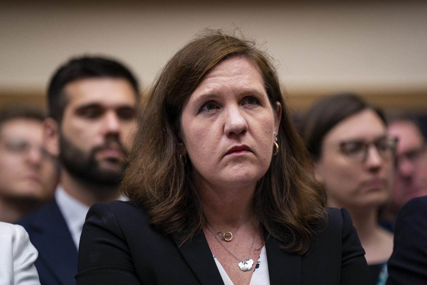 Rebecca Slaughter, commissioner at the Federal Trade Commission (FTC), listens in a black suit and a necklace during a House Judiciary Committee hearing in Washington, DC, US, on Thursday, July 13, 2023.