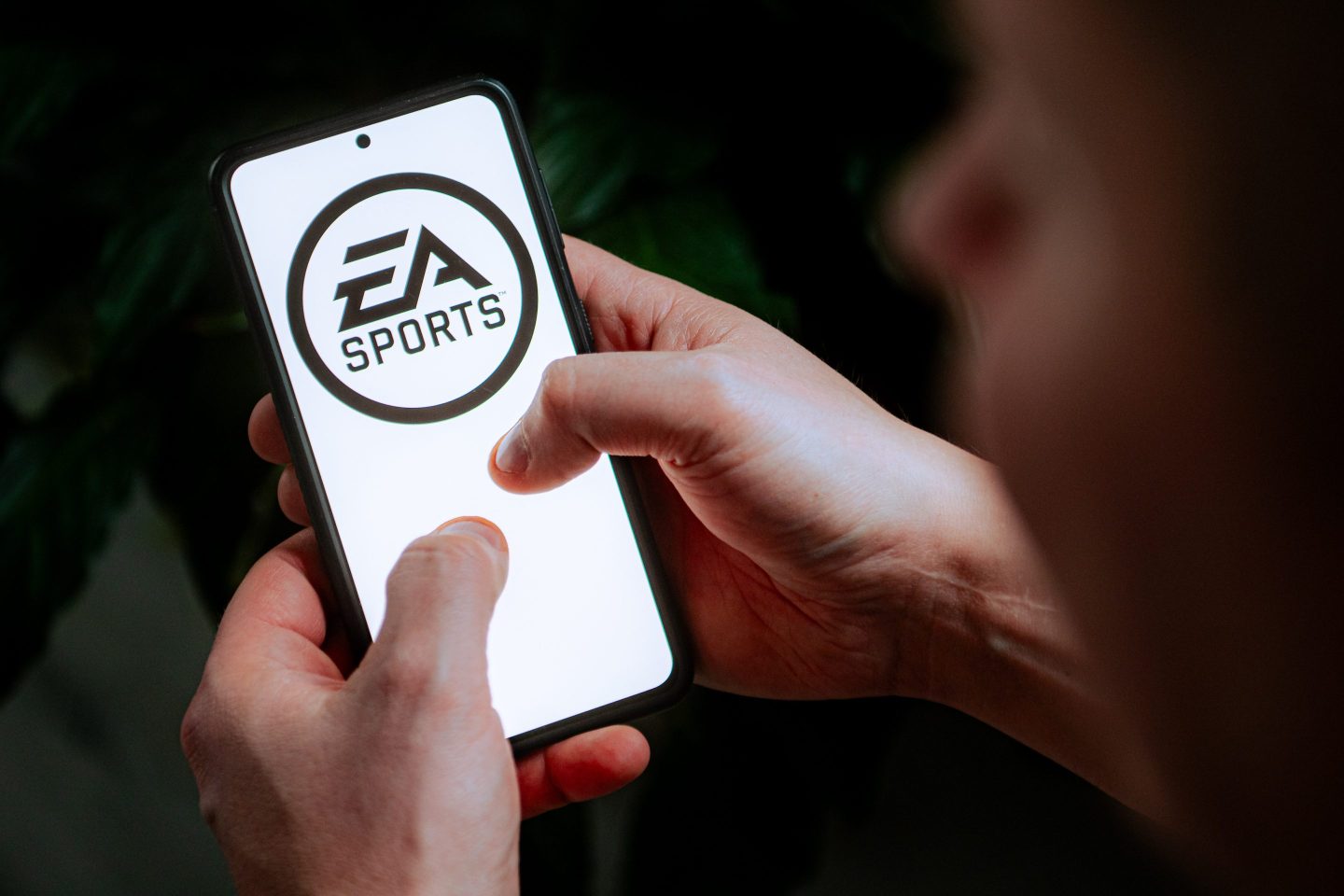 In this photo illustration an EA Sports logo seen displayed on a smartphone.