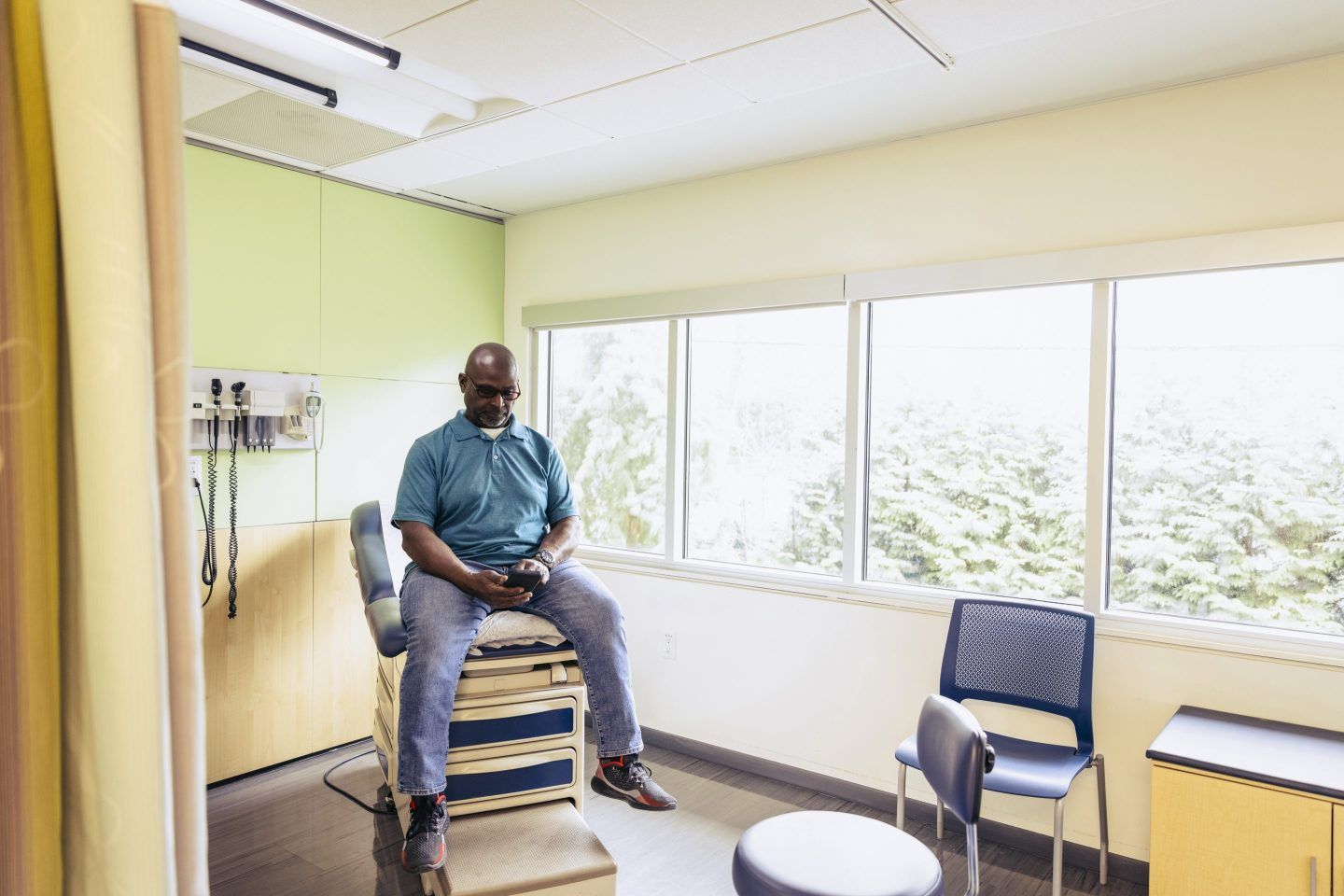 Man waiting for the doctor in an examination room