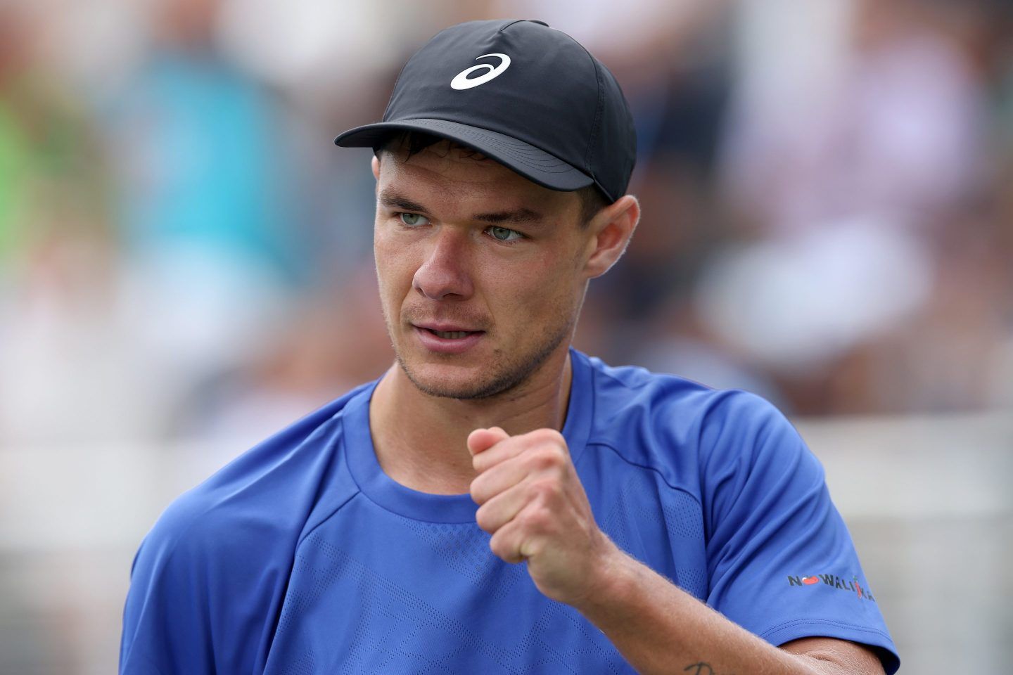 Kamil Majchrzak of Poland raises his fist with a focused look during the U.S. open.