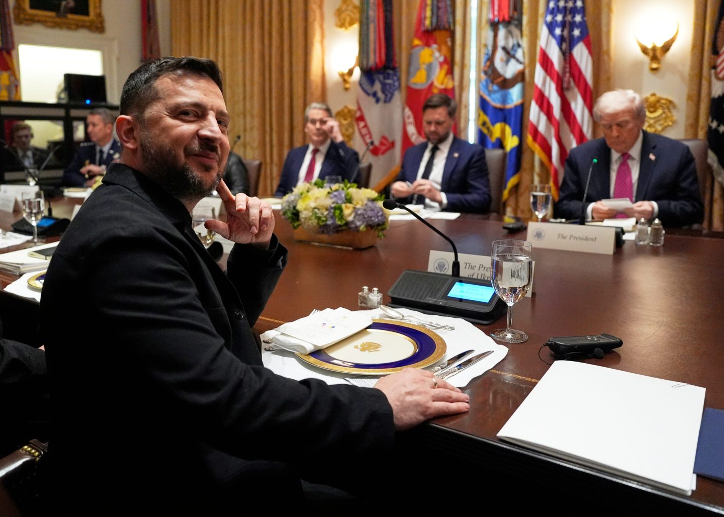 Ukraine's President Volodymyr Zelenskyy, left, sits before a meeting with President Donald Trump, from right, Vice President JD Vance and Treasury Secretary Scott Bessent in the Cabinet Room of the White House on Friday.