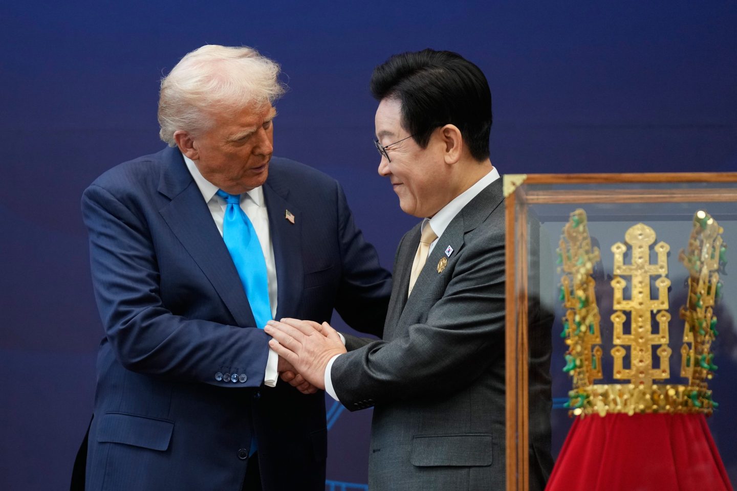 President Donald Trump shakes hands with South Korean President Lee Jae Myung as they attend a high honor ceremony at the Gyeongju National Museum in Gyoeongju, South Korea, Wednesday, Oct. 29, 2025.
