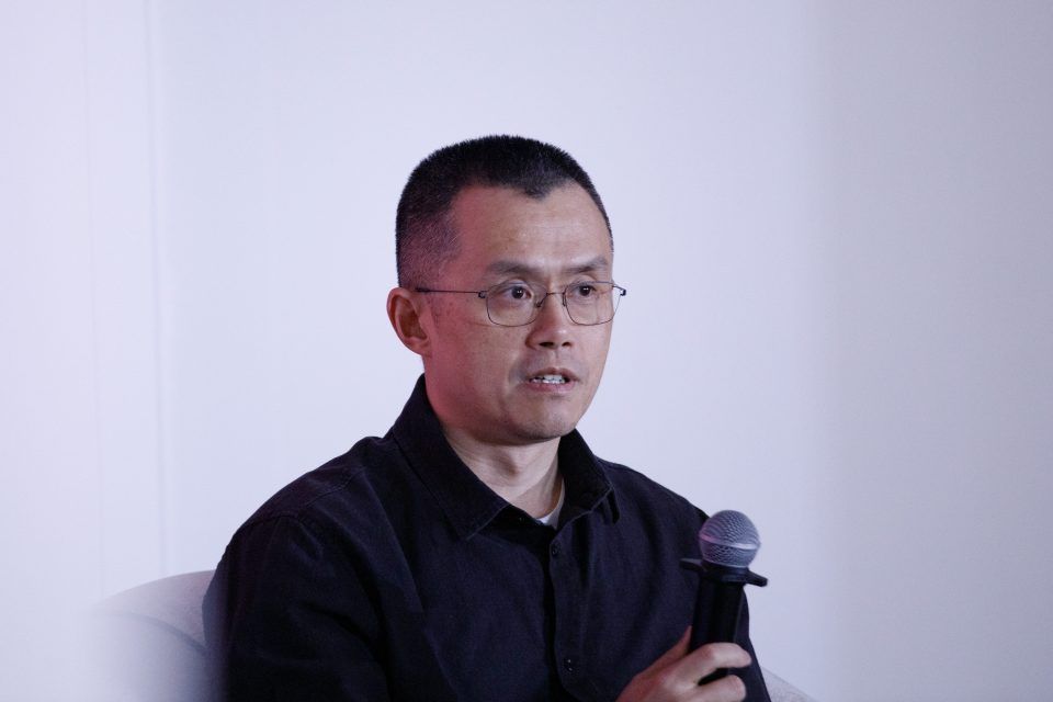 Changpeng Zhao with a microphone in hand.