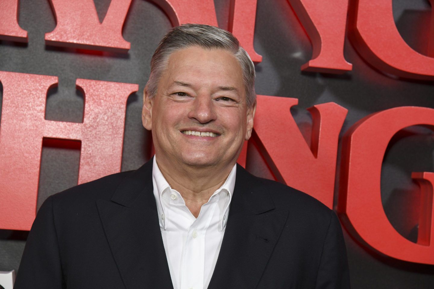 Netflix co-CEO Ted Sarandos flashes a smile