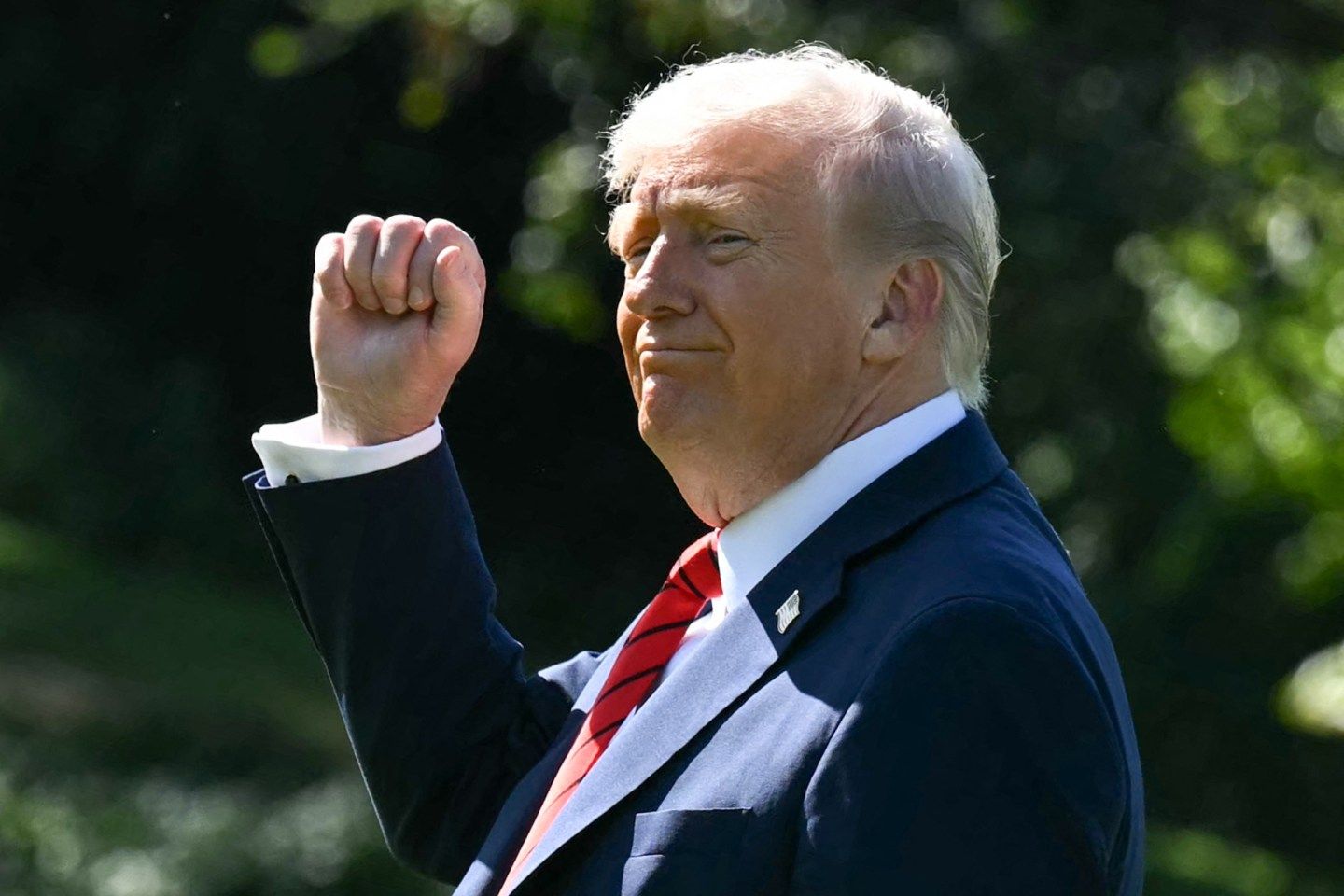 US President Donald Trump gestures as he walks to Marine One on the South Lawn of the White House in Washington, DC, on October 10, 2025.
