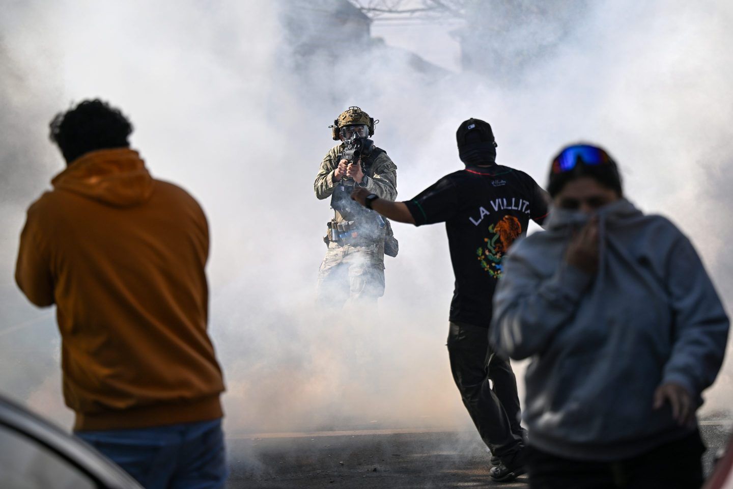 Residents and protesters clash with federal agents in the East Side neighborhood on October 14, 2025 in Chicago, Illinois.