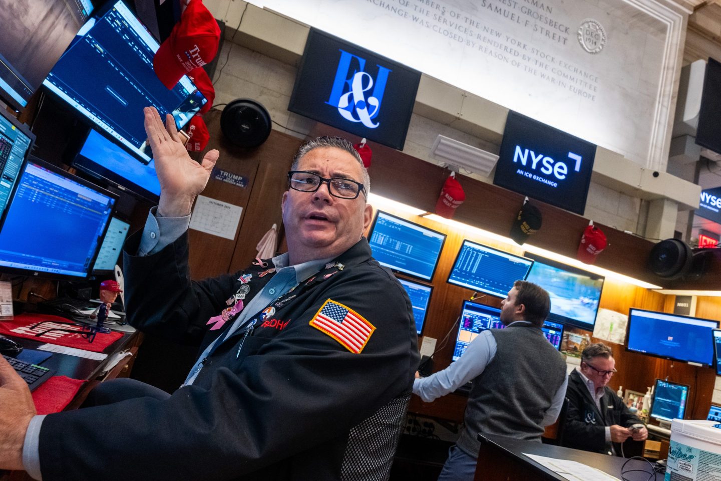 Traders work on the floor of the New York Stock Exchange on Friday.